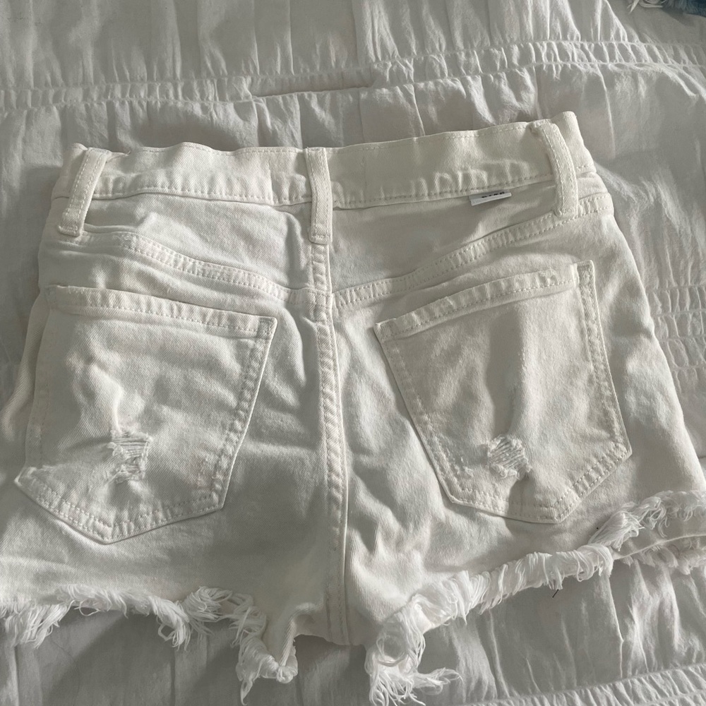 WHITE DENIM SHORTS, distressed.